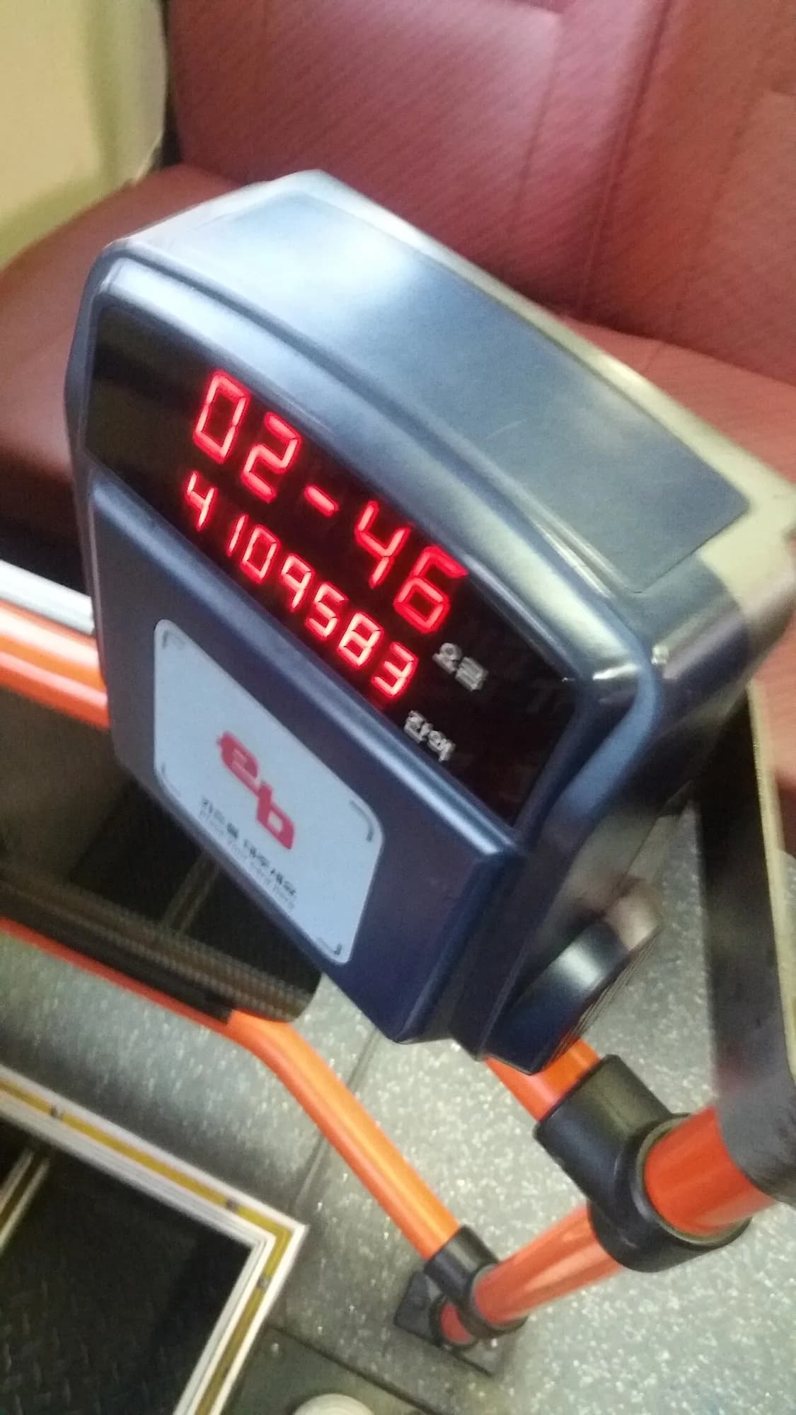 A Korean bus transit-card reader mounted beside the door