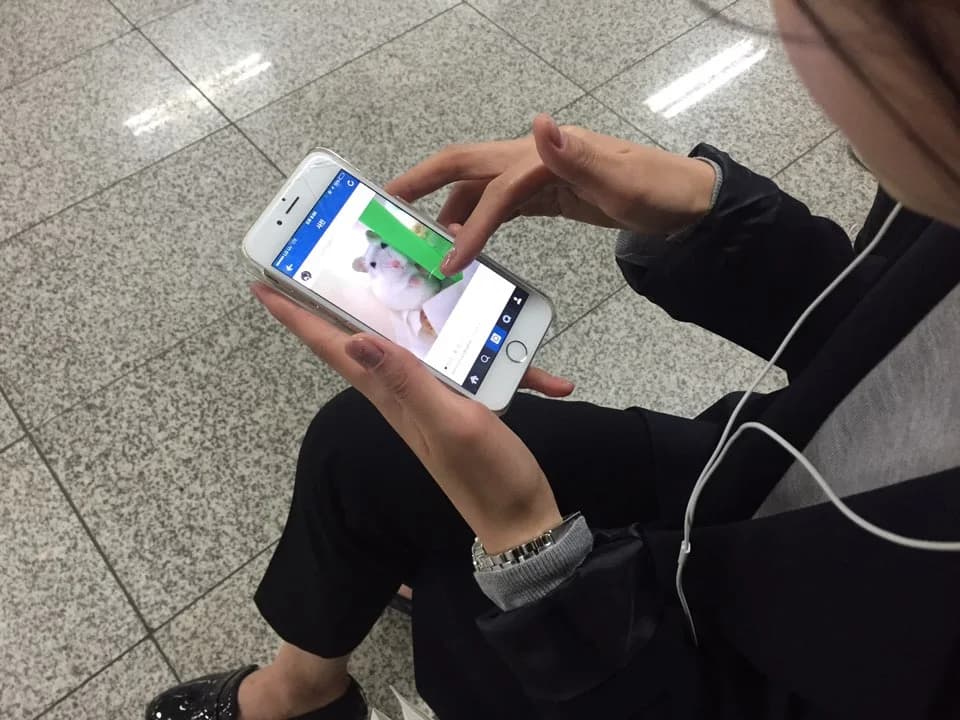 A person using a smartphone in South Korea