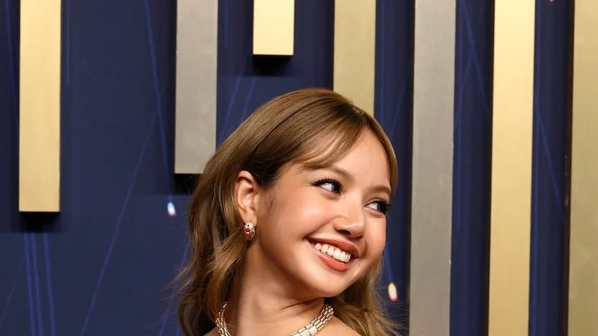 LISA attending the 2026 Emmy Awards in a pink evening gown