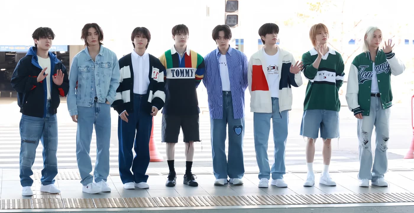 The eight members of Stray Kids standing together at Incheon Airport in May 2024