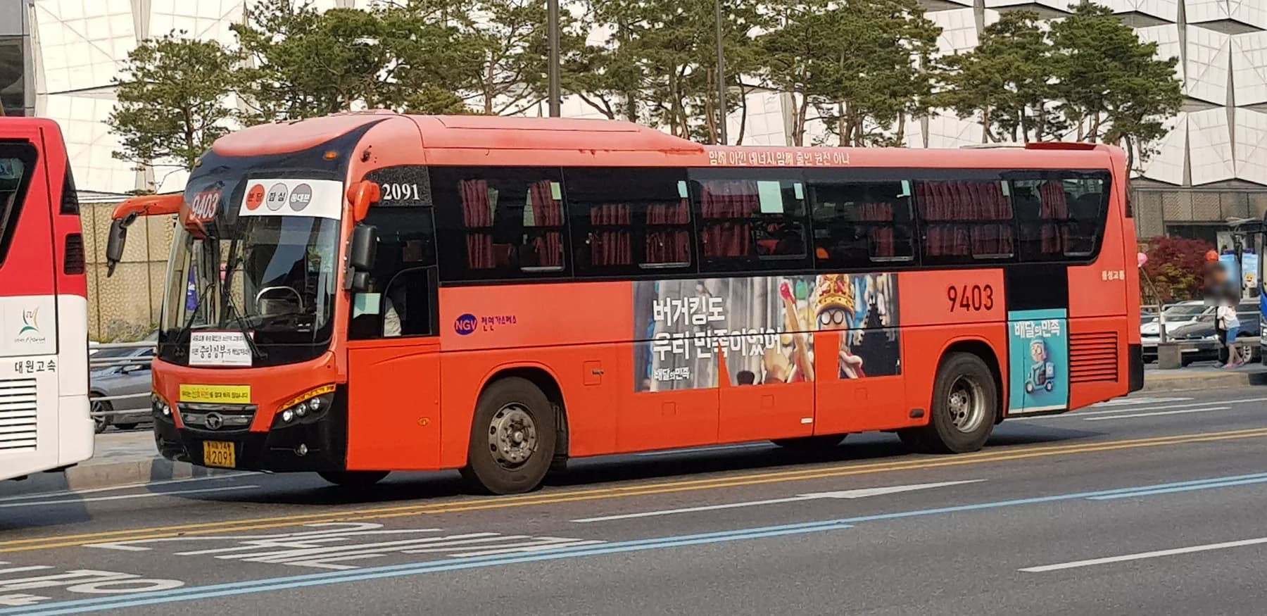 A red metropolitan bus on Seoul route 9403